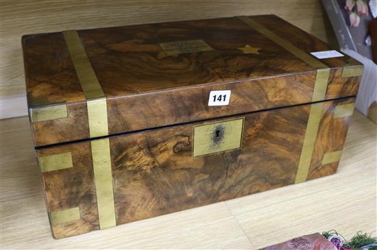 An Edwardian brass bound walnut writing slope, 50cm